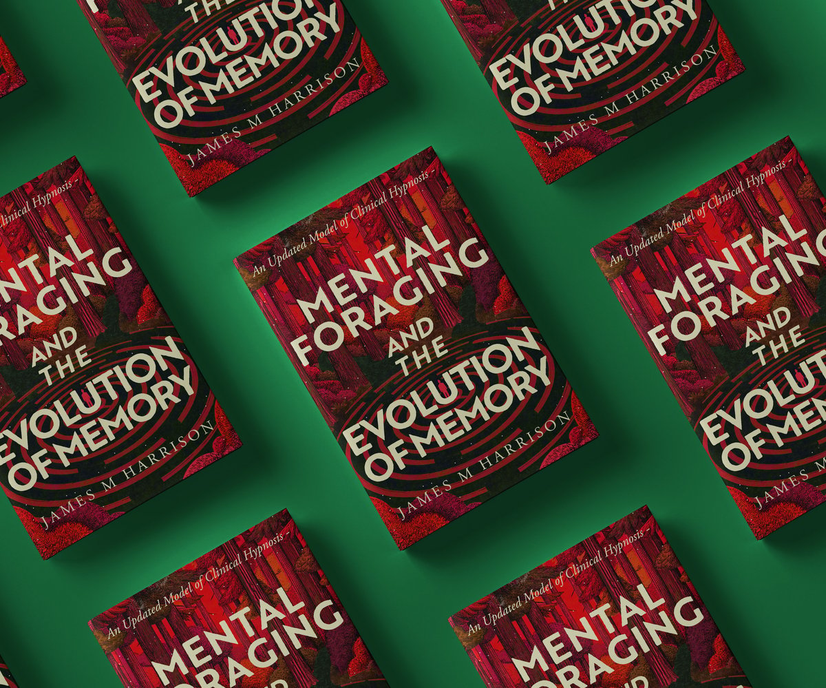 Multiple copies of Mental Foraging and the Evolution of Memory book with red covers arranged on a green background